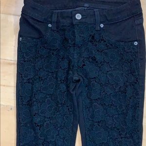 Black jeans with crochet on the front. Never worn